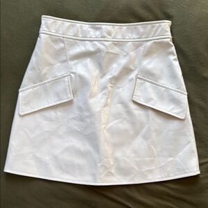 River Island Stylish White Mini Skirt.  Faux leather.  Size US 2.
